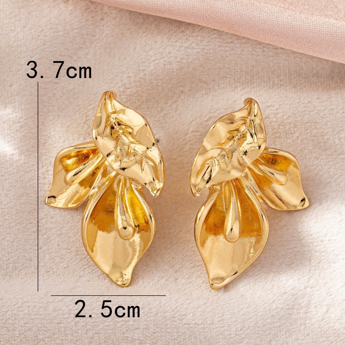 Bold gold sculpted floral statement earring, part of the Shai Valley Global Collection