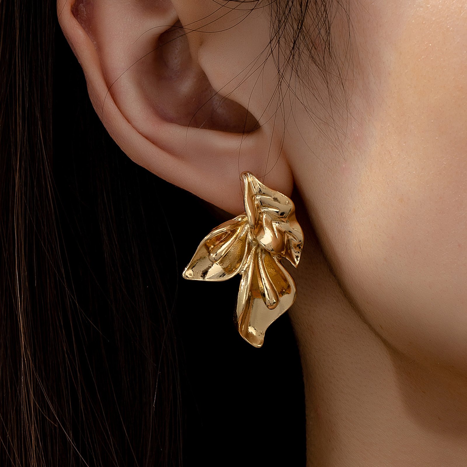 Bold gold sculpted floral statement earring, part of the Shai Valley Global Collection