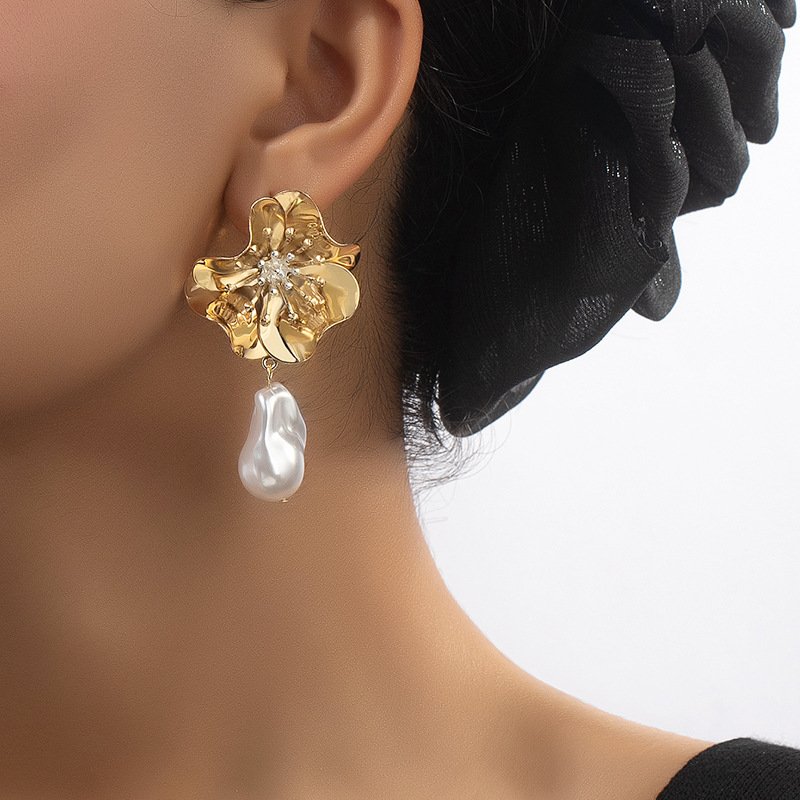 Gold floral drop earrings with sculpted flower design and dangling pearl – Shai Valley Global Collection
