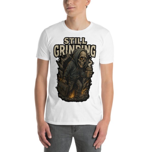 Still Grinding Tee – King Reigns Collection | Shai Valley LLC 19 White unisex t-shirt with bold “Still Grinding” graphic featuring hooded skeleton and briefcase